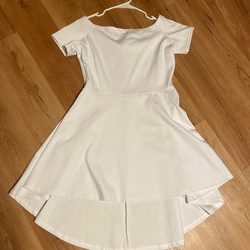 Short white dress, it is longer in the back, size large, never worn.